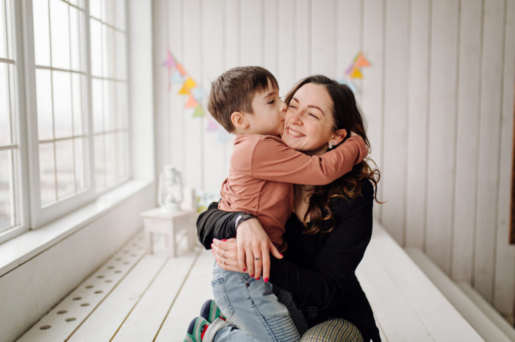 mother and son sitting indoors together