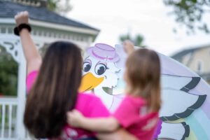 Bobbi and her daughter facing stork